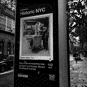 Kiosk on a sidewalk showing a historical photo from Museum of the City of New York.